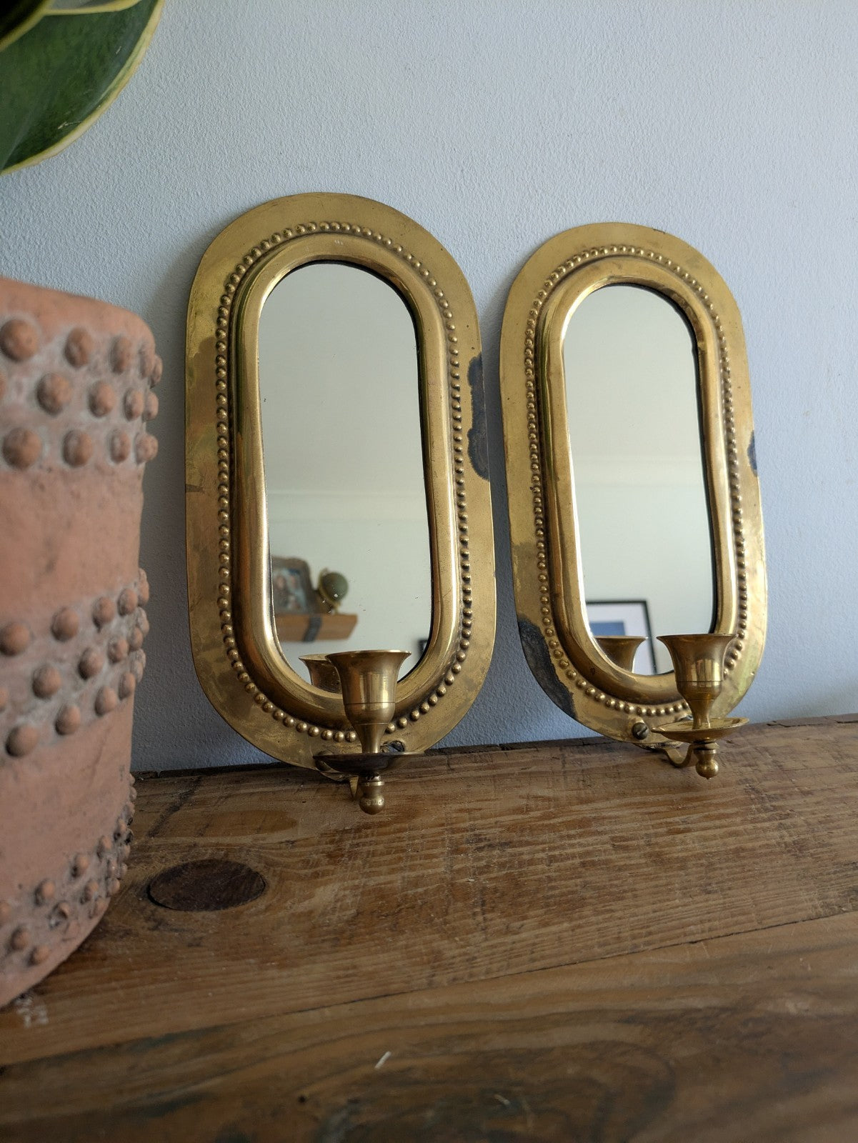 Pair Vintage MidC Scandinavian Repoussé Brass Candle Mirrored Wall Sconce Holder