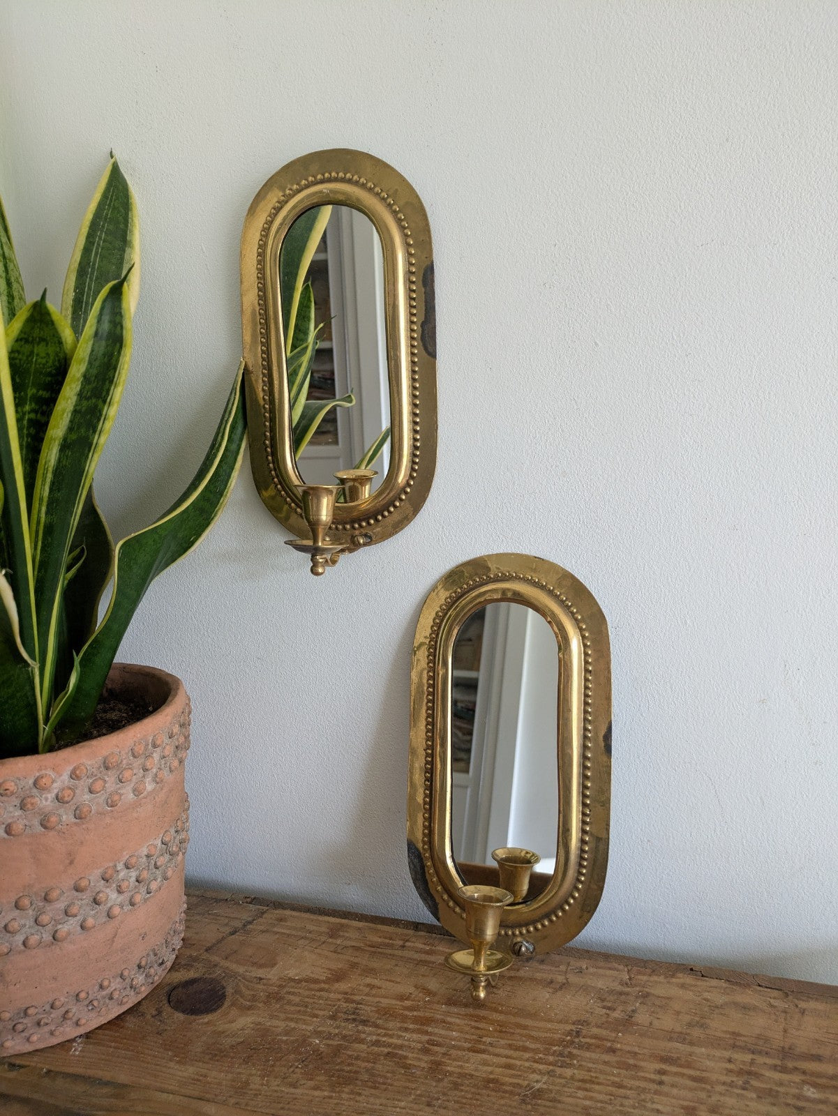 Pair Vintage MidC Scandinavian Repoussé Brass Candle Mirrored Wall Sconce Holder