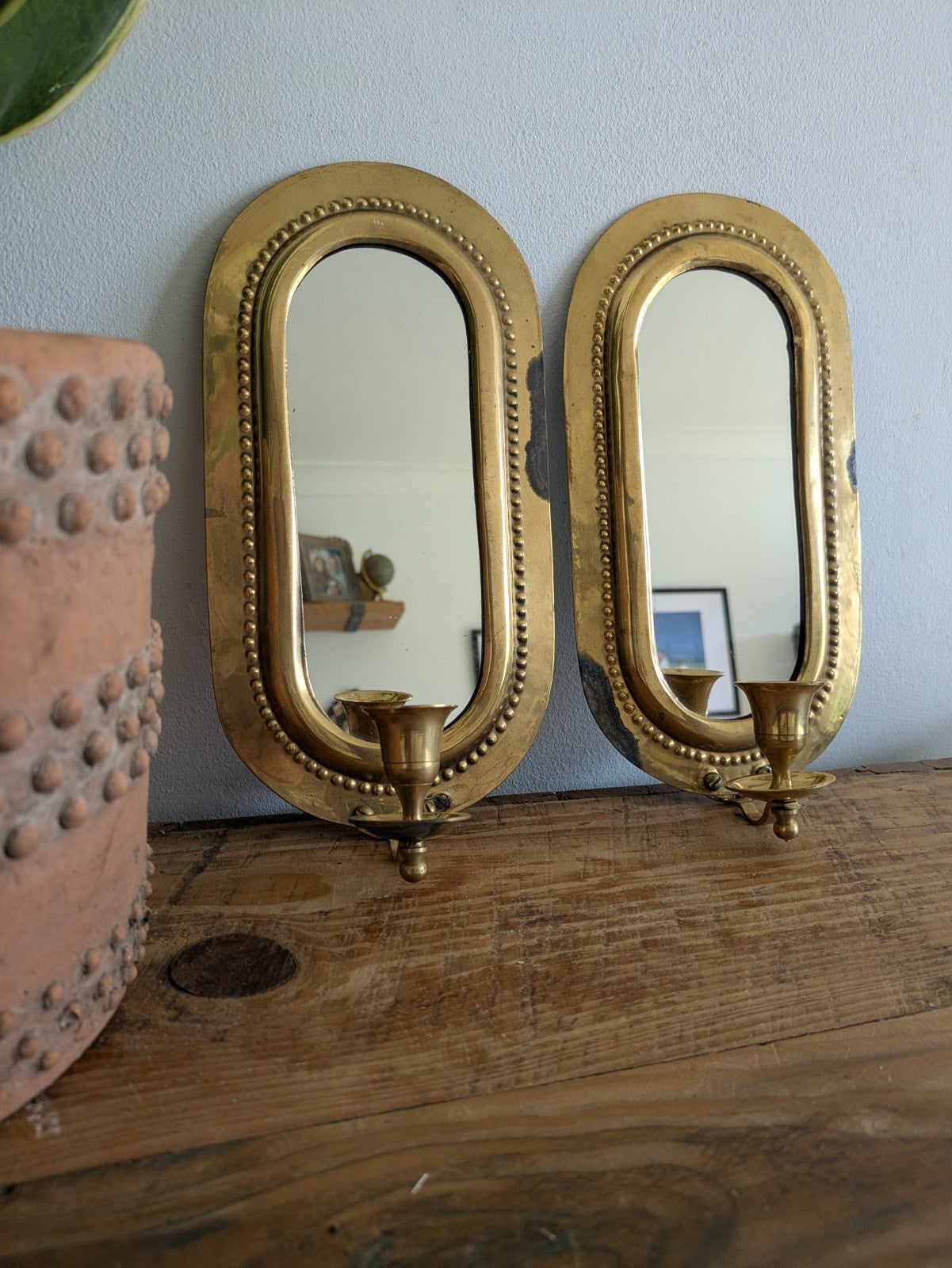 Pair Vintage MidC Scandinavian Repoussé Brass Candle Mirrored Wall Sconce Holder