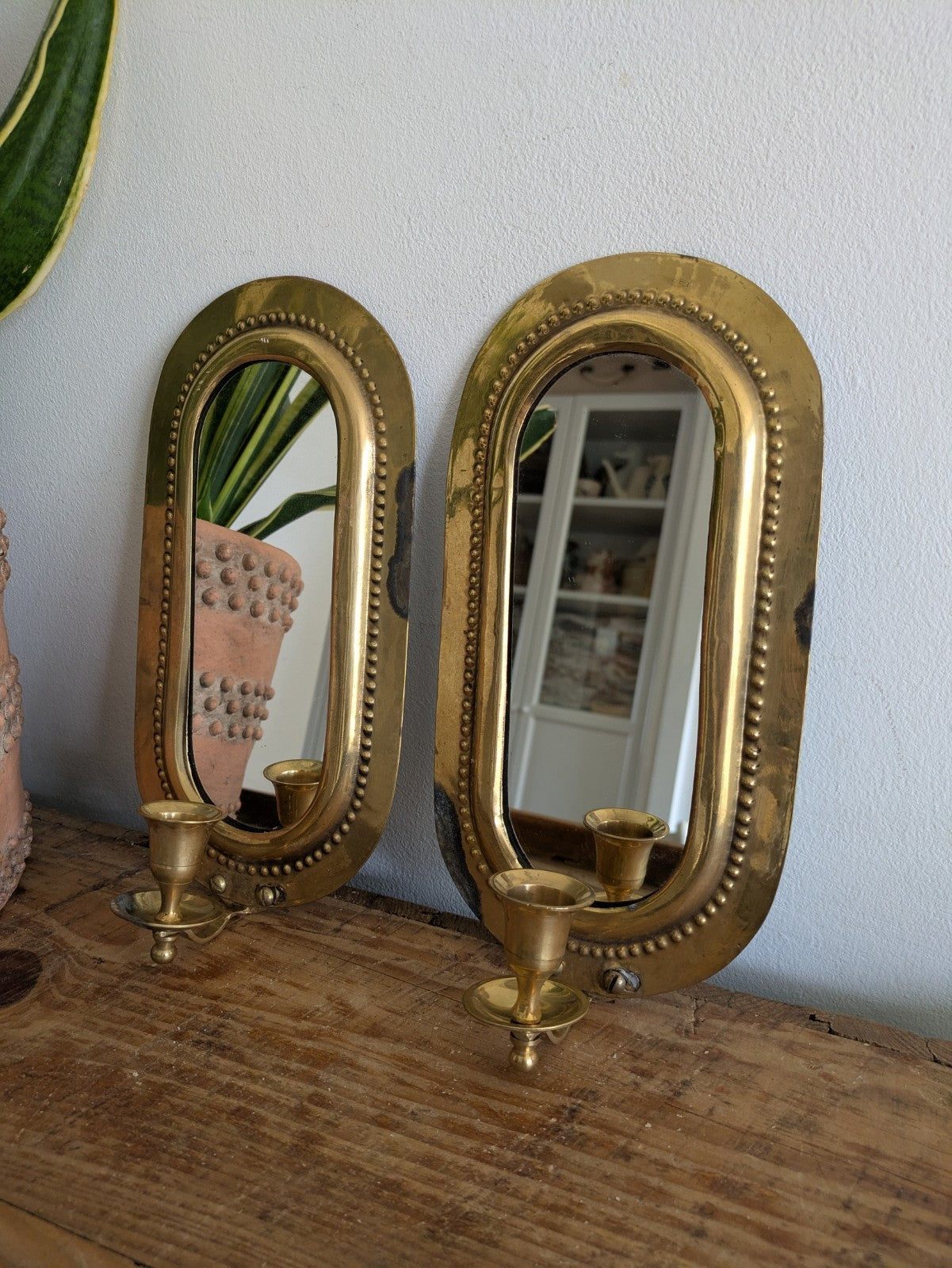 Pair Vintage MidC Scandinavian Repoussé Brass Candle Mirrored Wall Sconce Holder