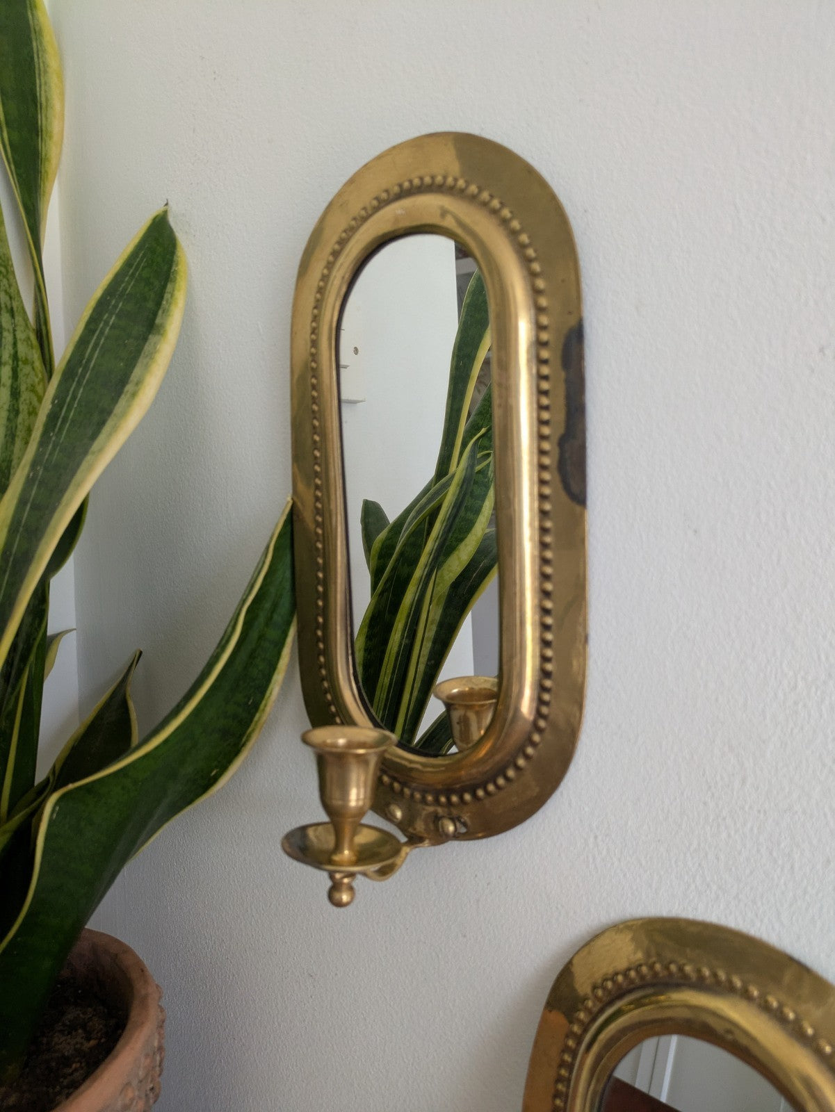 Pair Vintage MidC Scandinavian Repoussé Brass Candle Mirrored Wall Sconce Holder