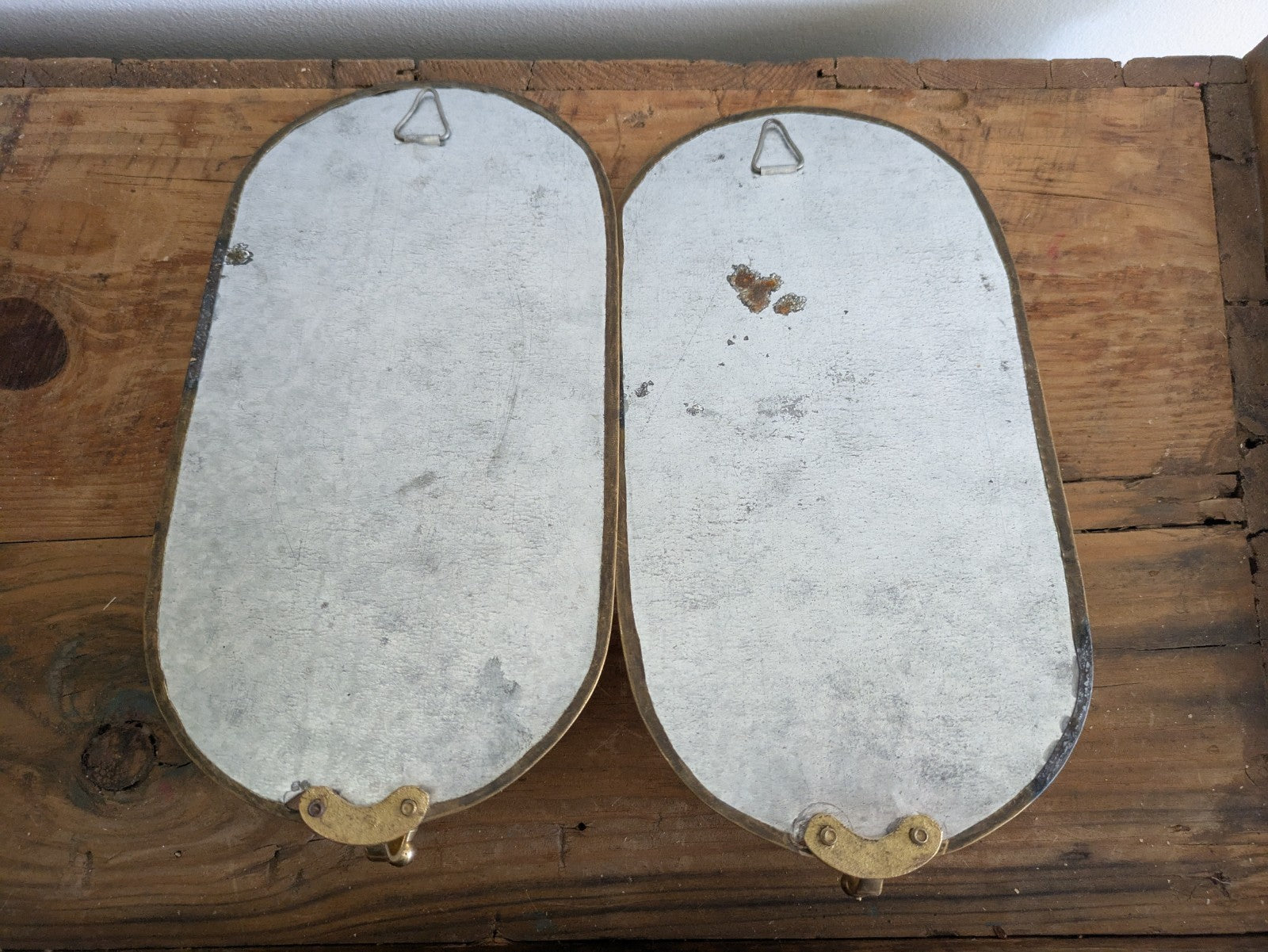 Pair Vintage MidC Scandinavian Repoussé Brass Candle Mirrored Wall Sconce Holder
