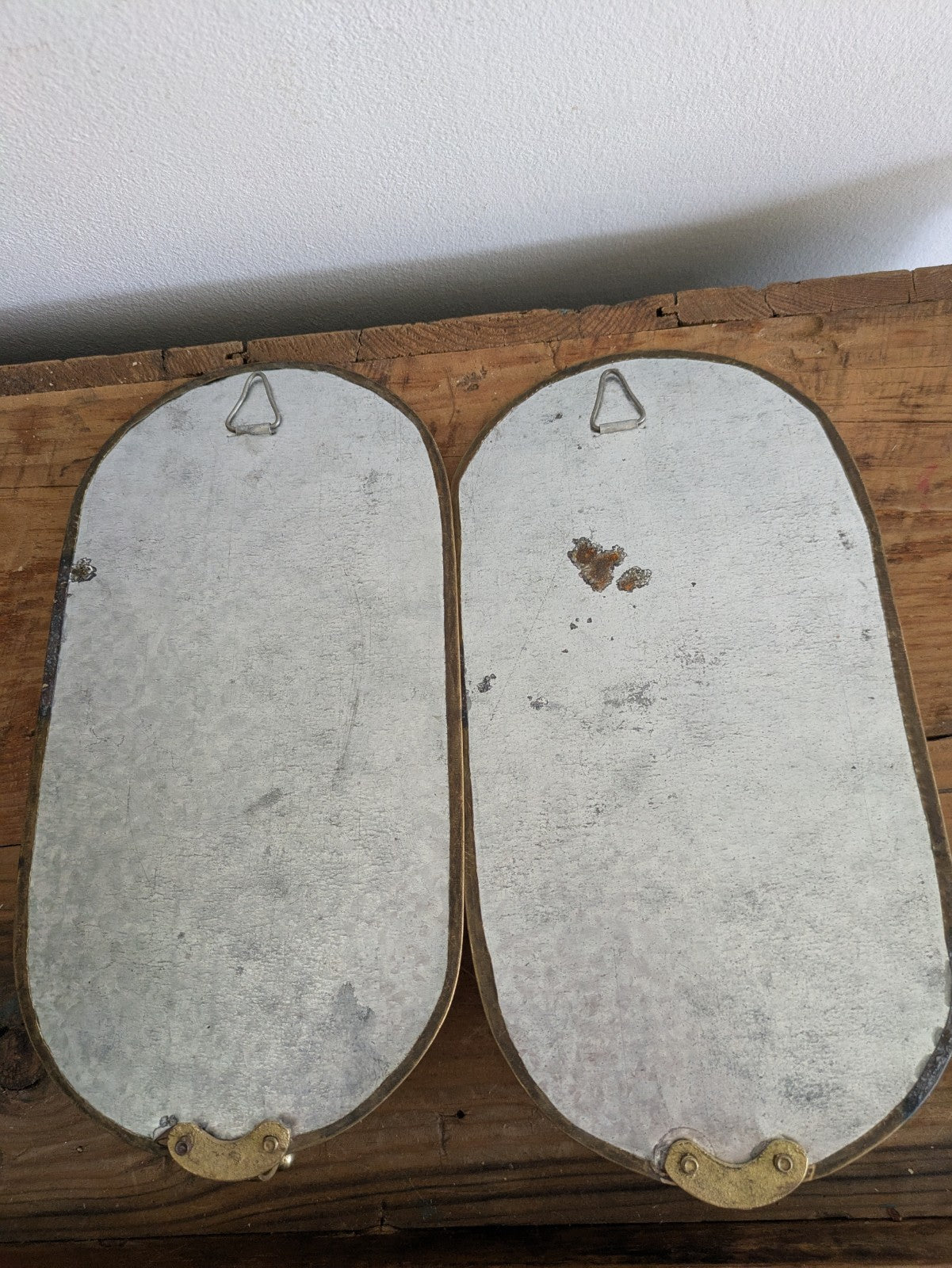Pair Vintage MidC Scandinavian Repoussé Brass Candle Mirrored Wall Sconce Holder