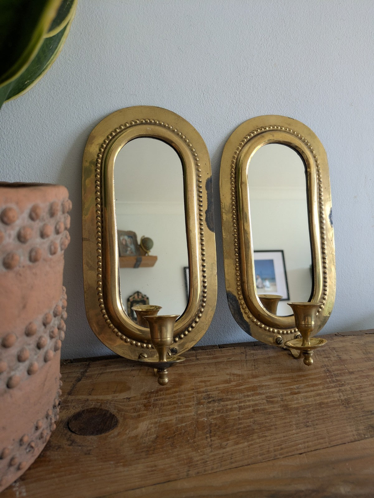 Pair Vintage MidC Scandinavian Repoussé Brass Candle Mirrored Wall Sconce Holder