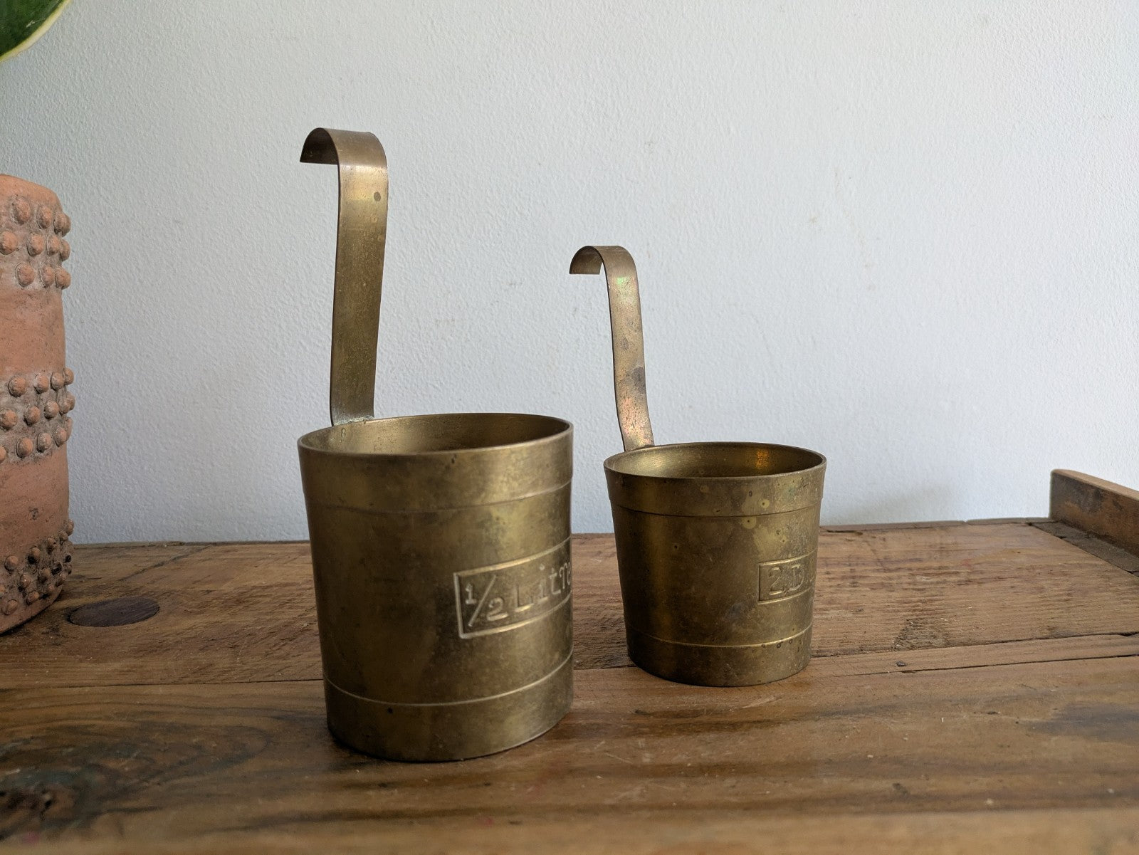 Set 2 Measuring Cups. Brass. Hanging Hooks. Vintage Planters x2 Milk Pots Props