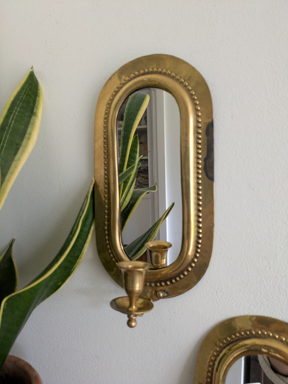 Pair Vintage MidC Scandinavian Repoussé Brass Candle Mirrored Wall Sconce Holder