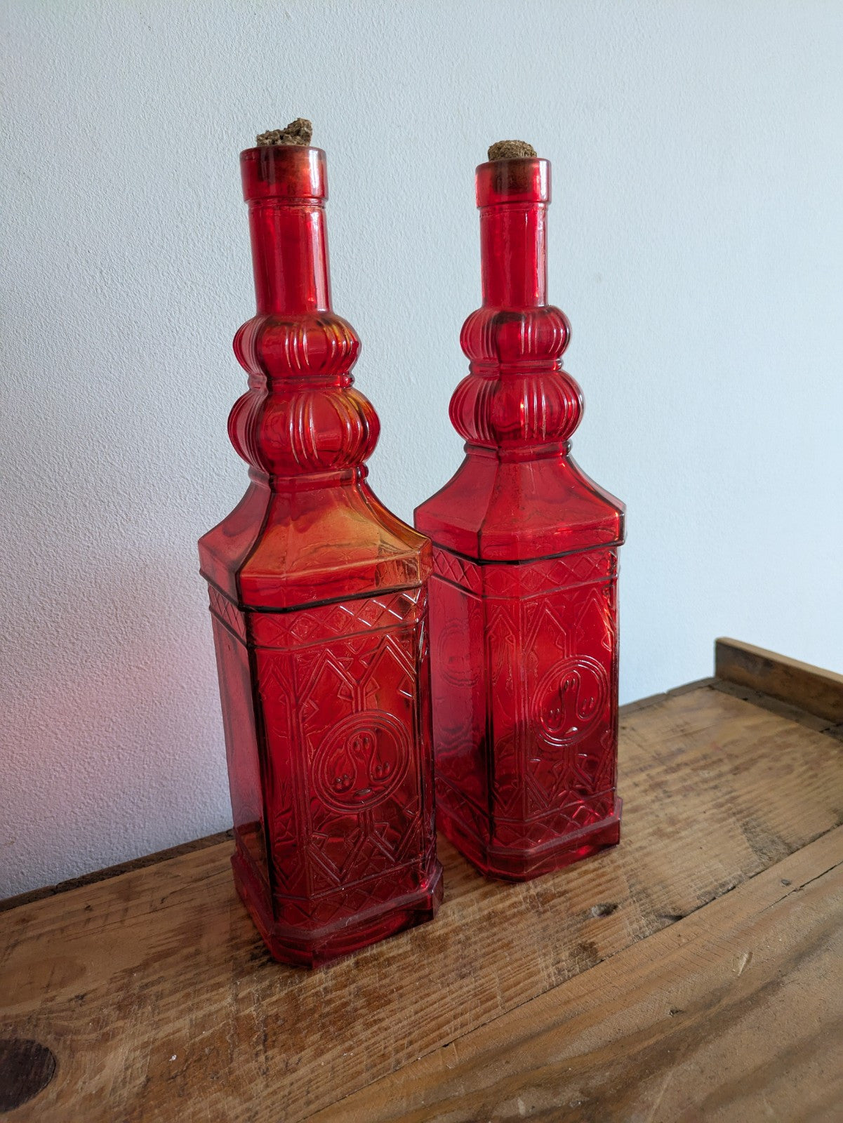 2x Ruby Red Embossed Glass Bottles 30cm Tall Pair Bar Mancave Boho Hippy VTG Old