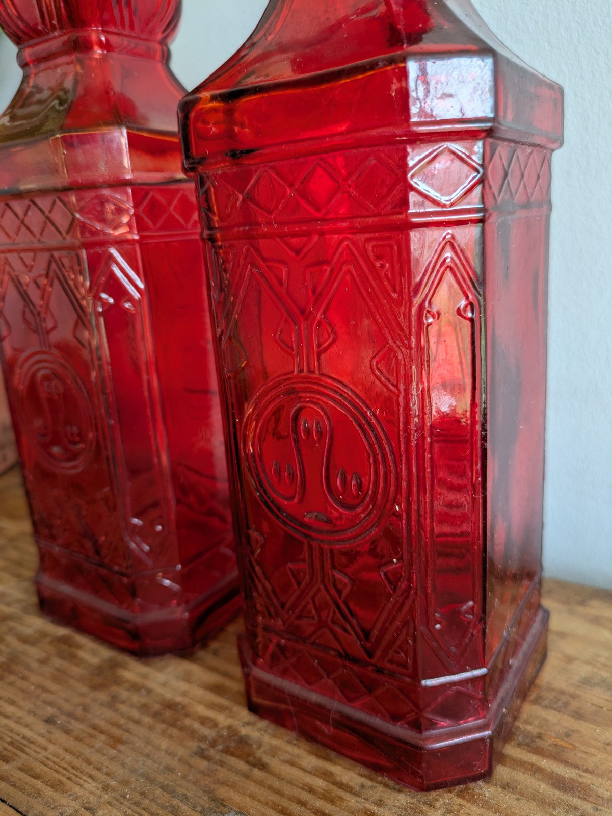 2x Ruby Red Embossed Glass Bottles 30cm Tall Pair Bar Mancave Boho Hippy VTG Old